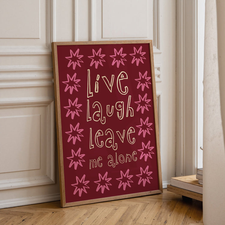 Live Laugh Leave Me Alone print styled as part of a humorous gallery wall
