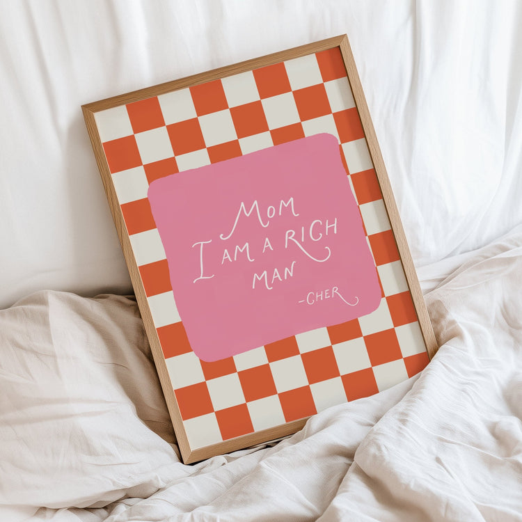 Mom I Am a Rich Man print displayed in a stylish modern bedroom interior