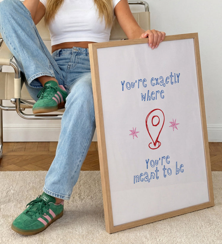 You're Exactly Where You're Meant To Be quote print displayed in a modern bedroom interior