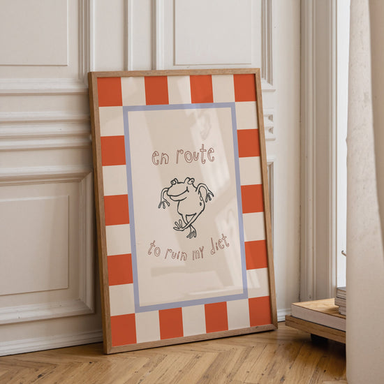 En Route to Ruin My Diet quote print displayed in a modern kitchen interior