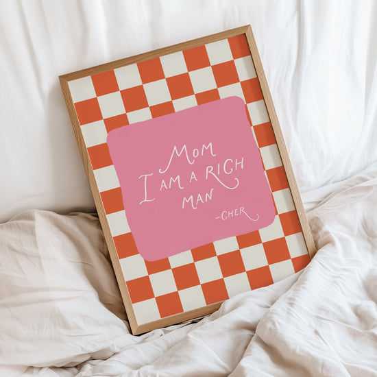 Mom I Am a Rich Man print displayed in a stylish modern bedroom interior