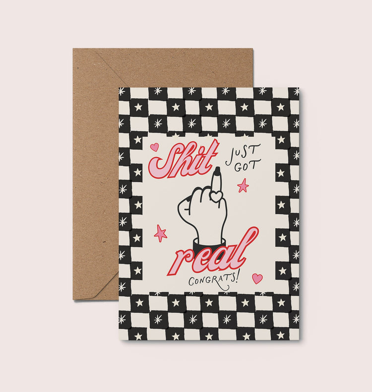 The Sh*t Just Got Real engagement card displayed with its recycled brown kraft envelope, part of the Moonshine Prints humorous card range.