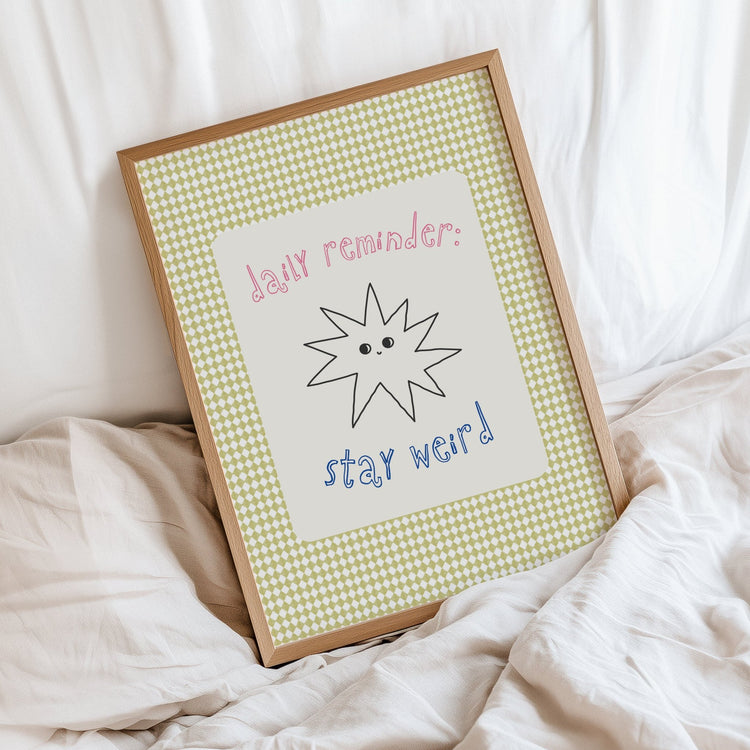 Close-up of Stay Weird typography print showing premium 300gsm matte paper finish
